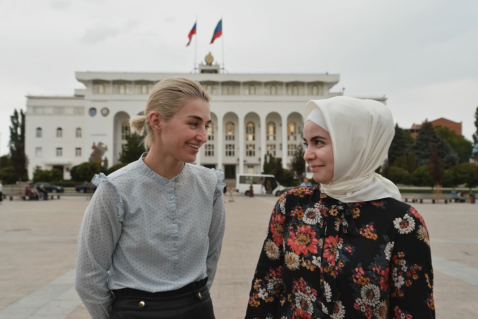 Photojournalist Anastasia Tsitsinova. Portraits. Untitled Nina Tseretilova and Maryam Gasanova in front of the administration of the city of Makhachkala, Dagestan. Girls fight against domestic violence in a Muslim region.