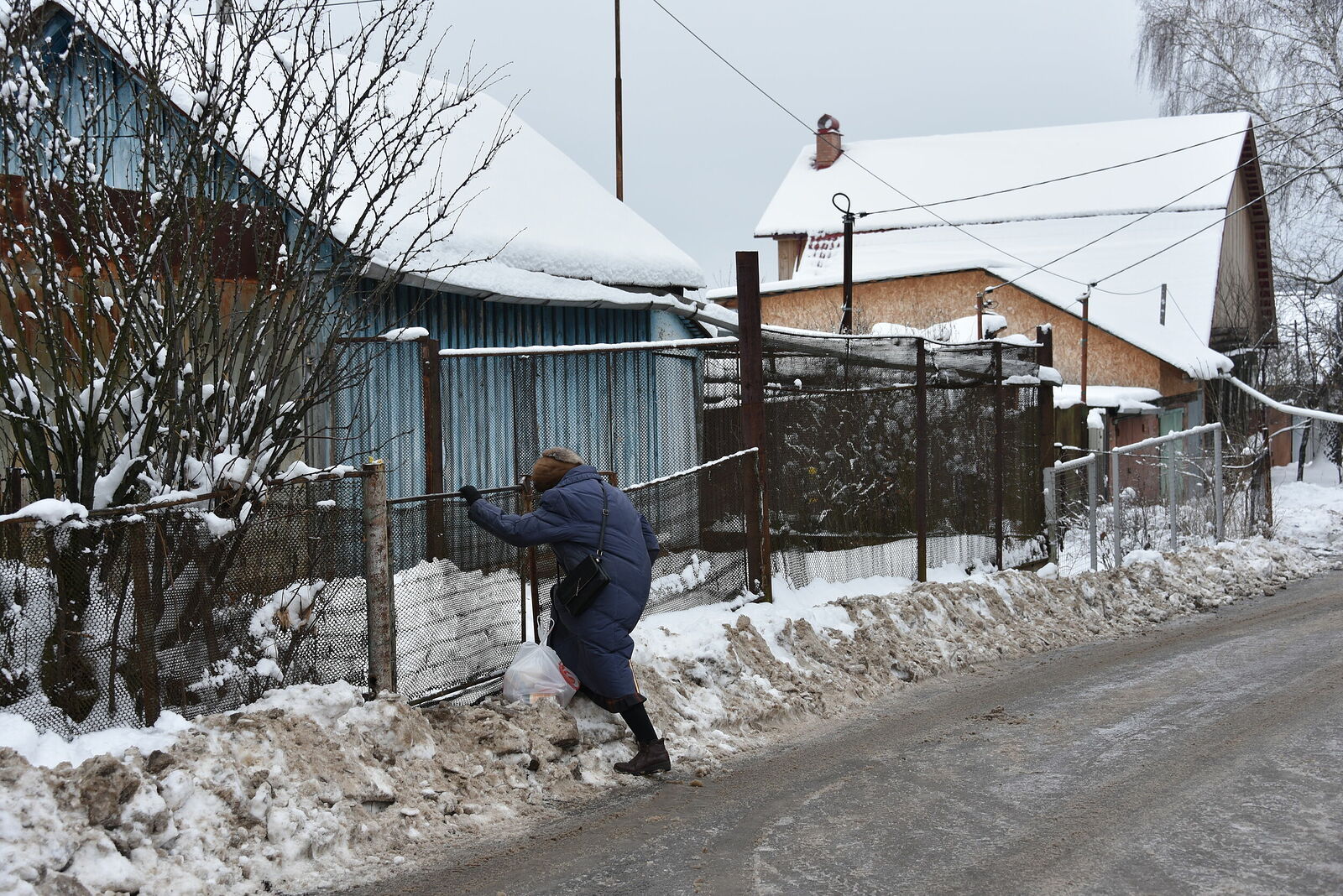 Photojournalist Anastasia Tsitsinova. Russia. Untitled The hostess of the house comes to her site, Serpukhov