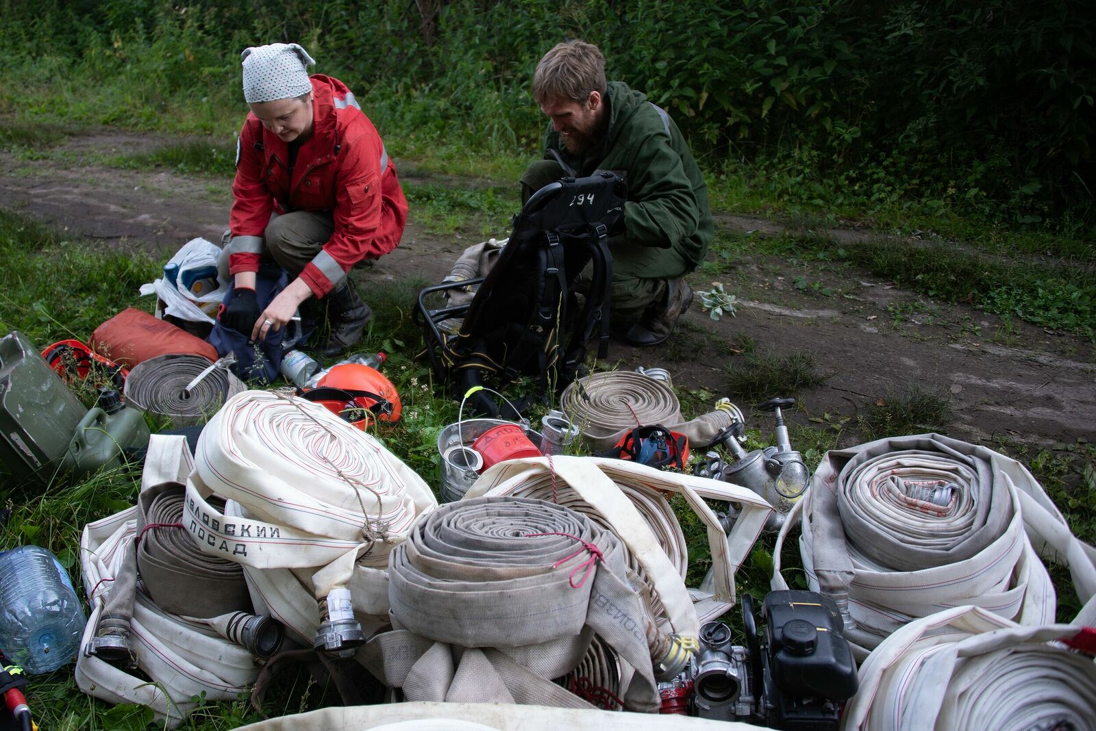Photojournalist Anastasia Tsitsinova. Volunteer firefighters. Untitled Firefighters lay out and check the sleeves
