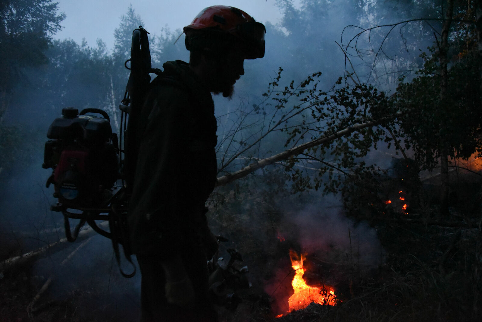 Photojournalist Anastasia Tsitsinova. Volunteer firefighters. Untitled Peat bogs. Firefighters scout and find peat burning underground