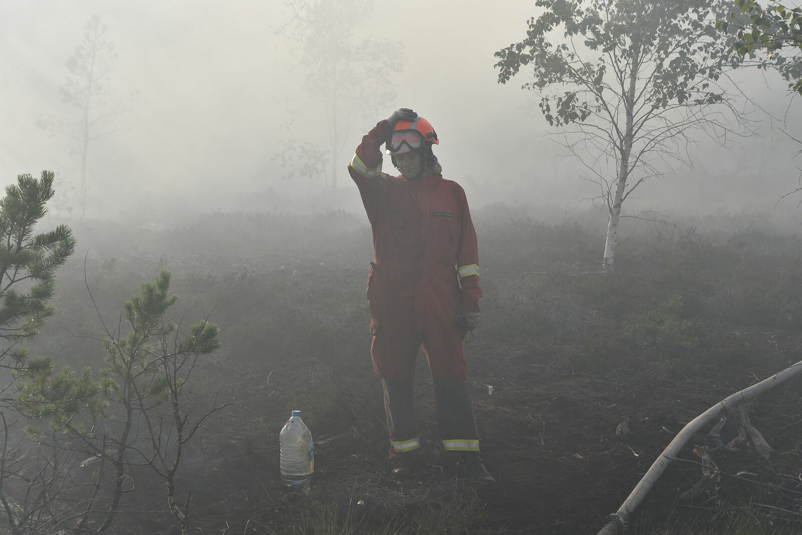 Photojournalist Anastasia Tsitsinova. Volunteer firefighters. Untitled Firefighters in smoke from peat fires